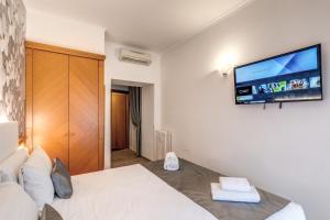 TV a/nebo společenská místnost v ubytování Roma dei Papi B&B