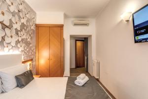 Postel nebo postele na pokoji v ubytování Roma dei Papi B&B