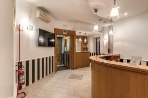 TV a/nebo společenská místnost v ubytování Roma dei Papi B&B