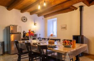 a dining room with a table with a bowl of fruit at Gite cantagrel in Saint-Alban-sur-Limagnole