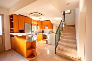 Кухня или мини-кухня в Villa Samaliana Sandy Beach Villas - Private Pool - Jacuzzi - Private Beach Area
