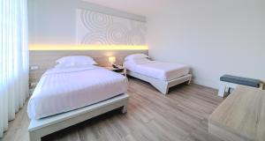 Voodi või voodid majutusasutuse Best Western Chaweng Samui toas