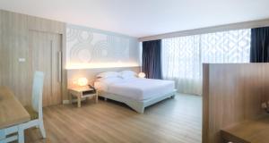 Voodi või voodid majutusasutuse Best Western Chaweng Samui toas