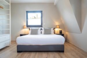 Postel nebo postele na pokoji v ubytování NürbLife Hotel