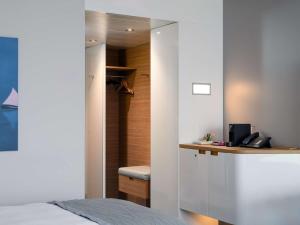 Mövenpick Hotel Lausanne客房内的一张或多张床位