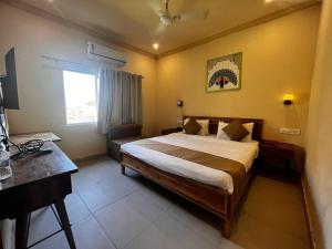 Voodi või voodid majutusasutuse Sambha Hotel toas