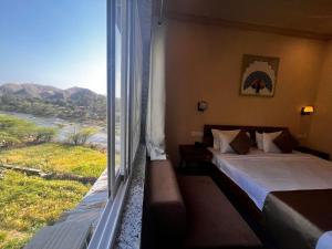 Postel nebo postele na pokoji v ubytování Sambha Hotel