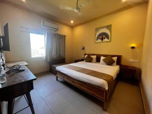 Postel nebo postele na pokoji v ubytování Sambha Hotel