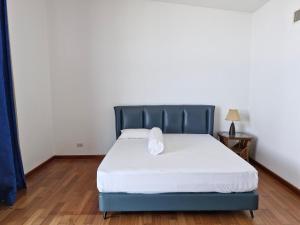 Postel nebo postele na pokoji v ubytování Palmeraiebeach Resort Rayong ปาล์มมาลี บีช รีสอร์ท ระยอง 罗勇棕榈树海滩酒店