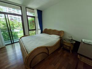Postel nebo postele na pokoji v ubytování Palmeraiebeach Resort Rayong ปาล์มมาลี บีช รีสอร์ท ระยอง 罗勇棕榈树海滩酒店