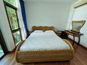 Postel nebo postele na pokoji v ubytování Palmeraiebeach Resort Rayong ปาล์มมาลี บีช รีสอร์ท ระยอง 罗勇棕榈树海滩酒店