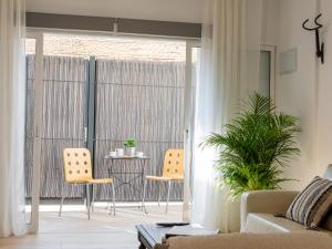 Posezení v ubytování Oasis Urbano Elche - Terraza y Vistas al Palmeral junto al Centro