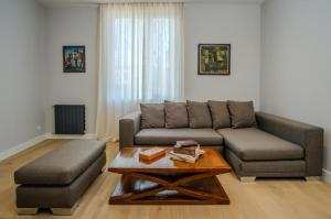 a living room with a couch and a coffee table at Villa in Avlabari in Tbilisi City