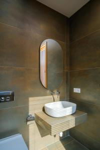a bathroom with a sink and a mirror at Villa in Avlabari in Tbilisi City +33 photos