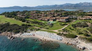 an aerial view of a resort with a beach at Due Lune Puntaldia Resort & Golf in San Teodoro