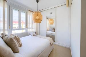 Postel nebo postele na pokoji v ubytování Sevilla Exclusive Apartment - Prime Location