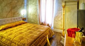 Postel nebo postele na pokoji v ubytování Boutique Hotel L'Imperatrice