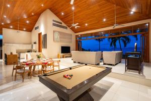 a living room with a pool table at Ban Reemo Luxury Villa in Chaweng