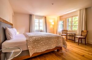 Postel nebo postele na pokoji v ubytování Chalet Pradella by Arosa Holiday + 29 fotografií