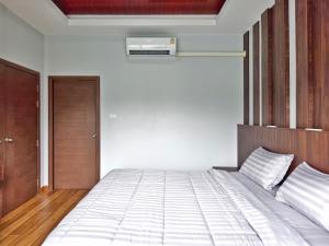 Ένα ή περισσότερα κρεβάτια σε δωμάτιο στο Arterra Haven Aonang Krabi