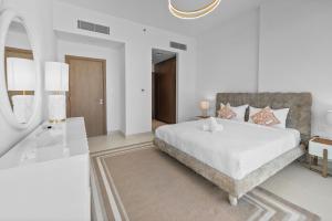 Krevet ili kreveti u jedinici u okviru objekta Magnificent - New 1BR in Canal Front Residences