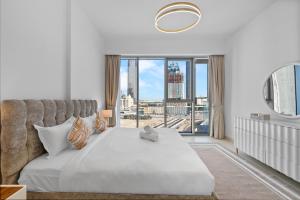 Krevet ili kreveti u jedinici u okviru objekta Magnificent - New 1BR in Canal Front Residences