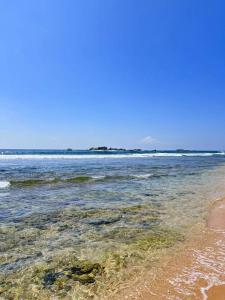 a view of the ocean from the beach at C-Born in Hikkaduwa