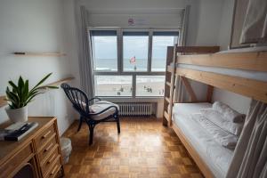 Postel nebo postele na pokoji v ubytování Boogalow Hostel