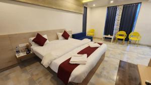 Postel nebo postele na pokoji v ubytování SeaFORT Beach Resort