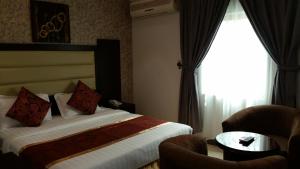 Ένα ή περισσότερα κρεβάτια σε δωμάτιο στο Mkani Apartment