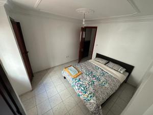 a bedroom with a bed with a book on it at Hyatt Residence Casa Voyageur in Casablanca