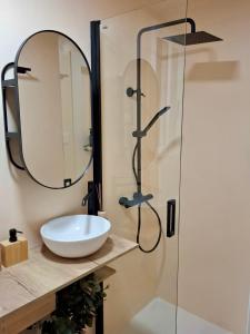 a bathroom with a sink and a shower at Casa Palmera in Sueca +19 photos