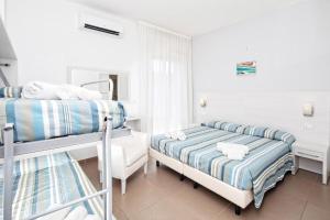 Voodi või voodid majutusasutuse Hotel Gin sul mare toas