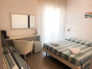 Voodi või voodid majutusasutuse Hotel Gin sul mare toas