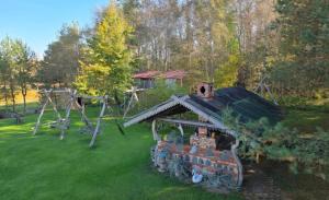 an aerial view of a house with a playground at Sodyba Pas Juzi in Alanta