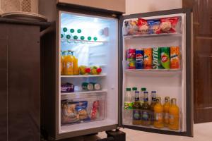 an open refrigerator full of drinks and drinks at Hotel City View Peshawar in Peshawar +16 photos