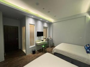 Кровать или кровати в номере Ding Dong Homestay