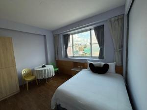 Кровать или кровати в номере Ding Dong Homestay