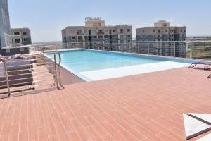 a swimming pool on the roof of a building at Cozy homes sabaki in Nairobi