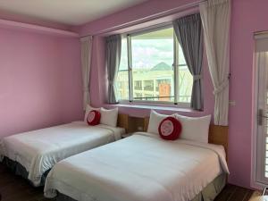 Кровать или кровати в номере Ding Dong Homestay
