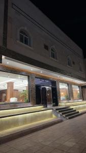 a building with steps in front of it at night at Alula Oasis1 in AlUla