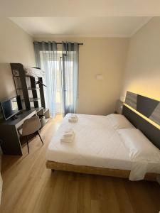 Postel nebo postele na pokoji v ubytování Hotel Laura