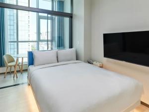 Postel nebo postele na pokoji v ubytování NewCZ Centum Hotel