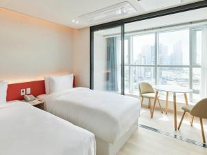 Postel nebo postele na pokoji v ubytování NewCZ Centum Hotel