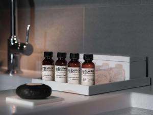 three bottles of spices sitting on a counter top at Pullman Paris Tour Eiffel in Paris