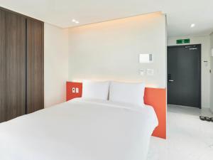 Postel nebo postele na pokoji v ubytování NewCZ Centum Hotel