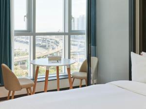 Postel nebo postele na pokoji v ubytování NewCZ Centum Hotel