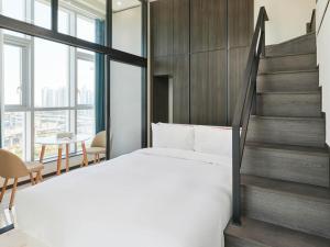 Postel nebo postele na pokoji v ubytování NewCZ Centum Hotel
