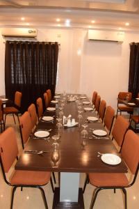 a large conference room with a long table and chairs at Falcon Beach Resort in Cox's Bazar