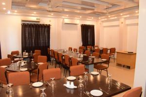a conference room with tables and chairs in it at Falcon Beach Resort in Cox's Bazar